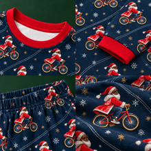 Load image into Gallery viewer, Bicycle Santa navy pajama set close-up details of neckline, cuffs, waistband and print
